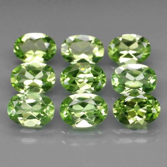 Dazzling 7.61ct untreated apple green Peridot set