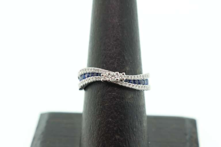 Flowing Channel Set 18k White Gold Sapphire and Diamond Ring with Triple-Stone Center