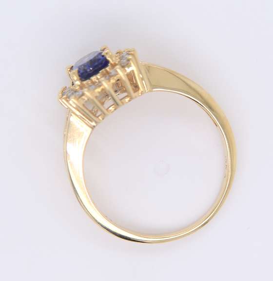 Romantic Yellow Gold oval Shaped Tanzanite and Diamond Ring