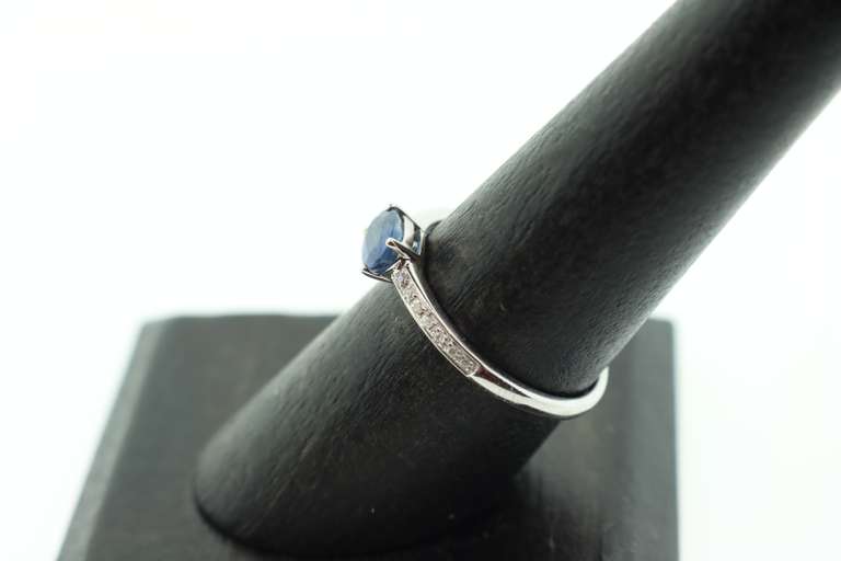 Phenominal Sapphire 18k White Gold Ring with Channel Set Diamonds