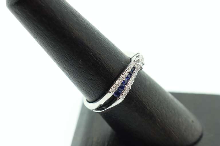 Flowing Channel Set 18k White Gold Sapphire and Diamond Ring with Triple-Stone Center