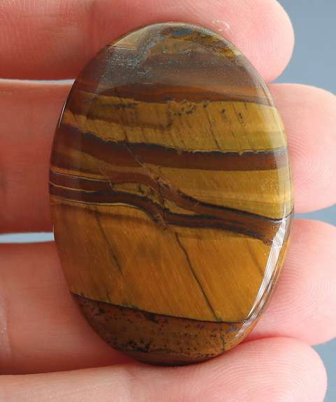 Dramatic 82.65ct Tiger Eye cabochon
