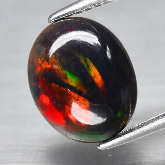 Magnificent 1.63ct full body flashing Black Opal
