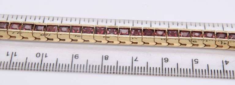 Attractive Yellow Gold Garnet Channel Set Bracelet