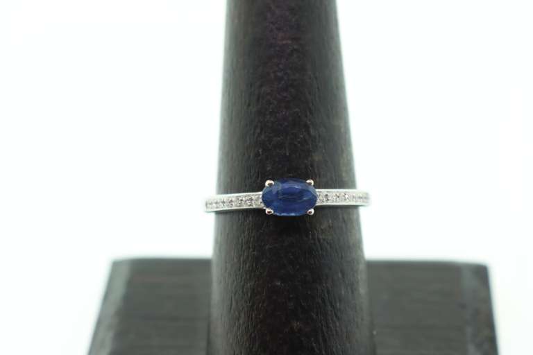 Phenominal Sapphire 18k White Gold Ring with Channel Set Diamonds