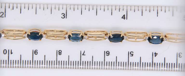 Attractive Yellow Gold Blue Sapphire and Diamond Tennis Bracelet