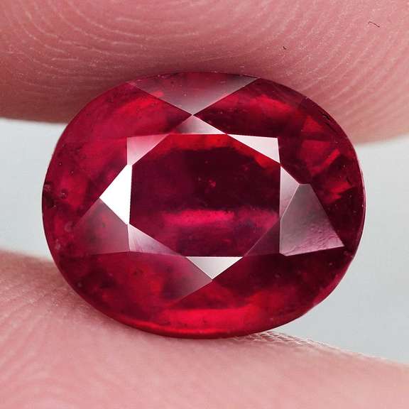 Stunning 7.14ct deep blood red Ruby center stone