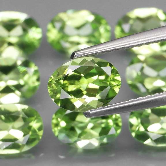 Dazzling 7.61ct untreated apple green Peridot set