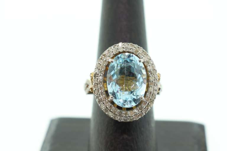 Gentle Blue Topaz Ring with Gold Plated Silver and Diamond Accents