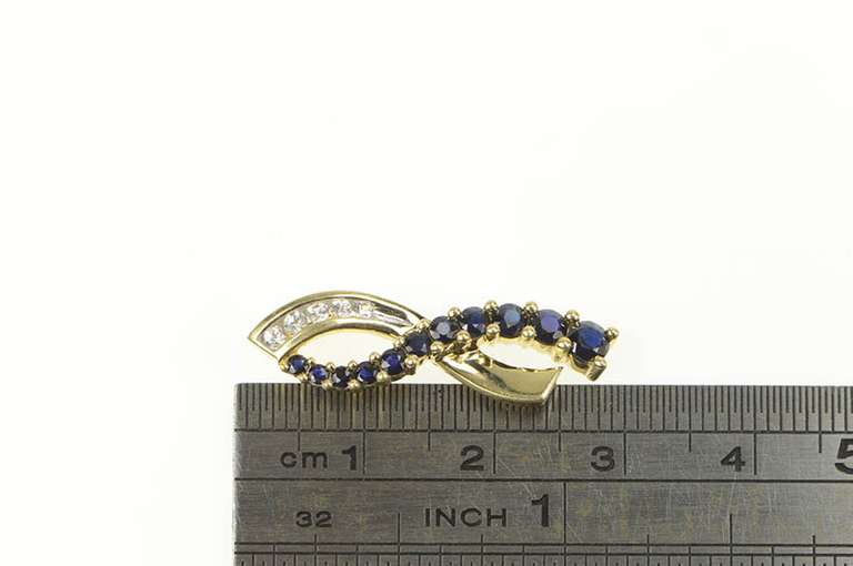 10K Yellow Gold Classic Loop Criss Cross Synthetic Sapphire CZ Pendant