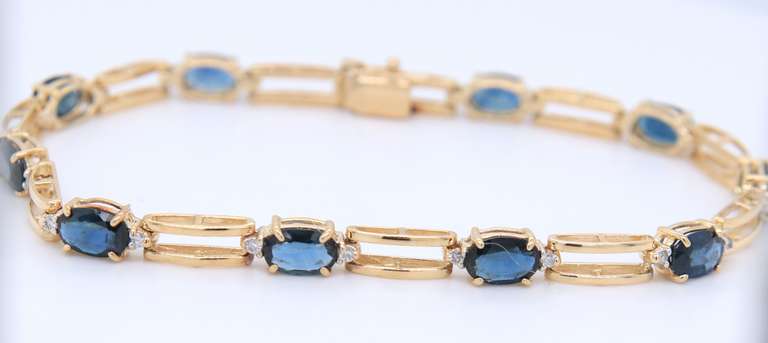 Attractive Yellow Gold Blue Sapphire and Diamond Tennis Bracelet