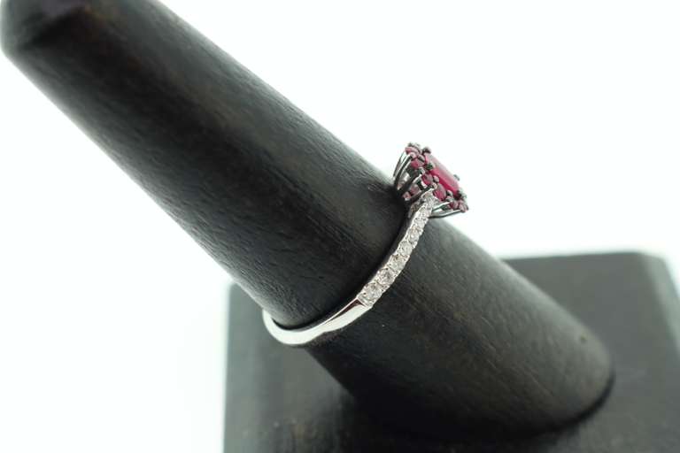 Exotic Crimson Ruby Halo Ring flanked with Diamonds on an 18k White Gold Band