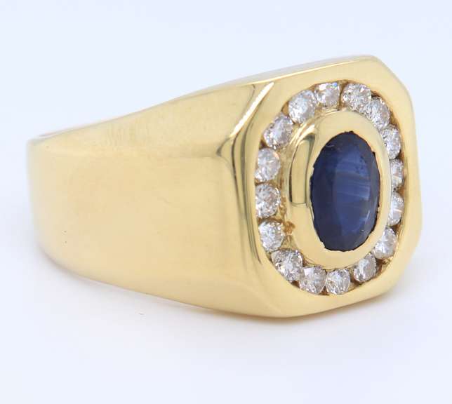 Handsome Yellow Gold oval Sapphire and Diamond Channel Halo Ring