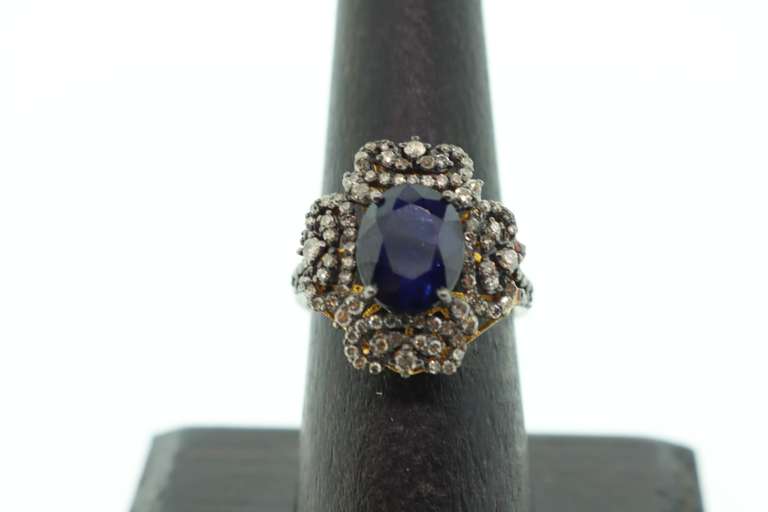 Impeccable Sapphire Ring with Intricate Diamond Studs on top Gold Plated Silver
