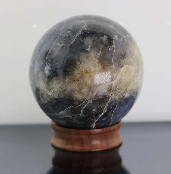 Tremendous 1,378ct sphere cut galaxy patterned Iolite