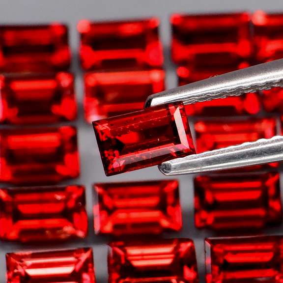 Nice 8.12ct emerald cut cherry red Garnet set