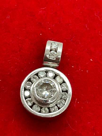 14K WHITE GOLD AND DIAMOND PENDANT.