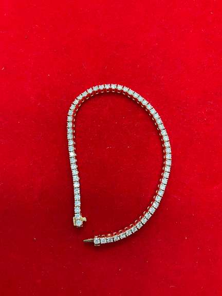 CERTIFIED 18K GOLD AND DIAMOND TENNIS BRACELET