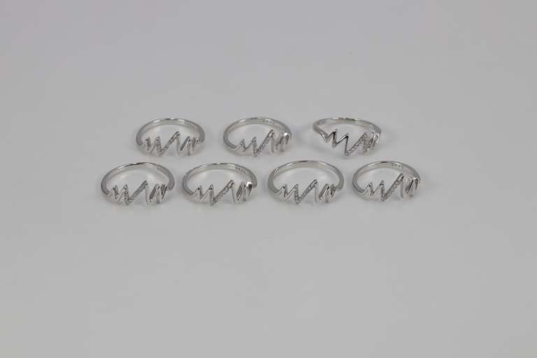 .925 Sterling Silver EKG Rings Lot of 40 Rings Various Sizes