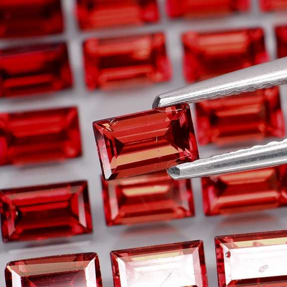 Nice 9.78ct emerald cut cherry red Garnet set