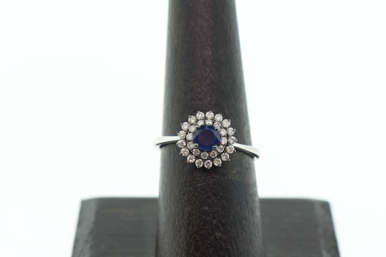 18k White Gold Sapphire Halo Ring surrounded with Diamonds