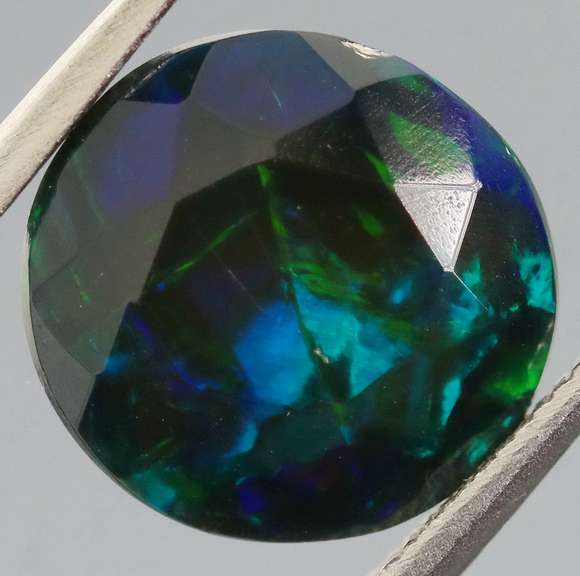 Glittering multi pattern flashing 1.84ct Welo black Opal