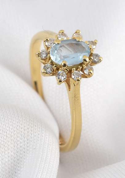 Feminine Blue Topaz and Diamond Ring