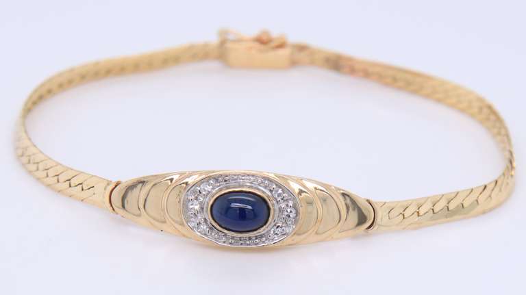 Lovely Yellow Gold Cab Oval Sapphire and Diamond Halo Bracelet