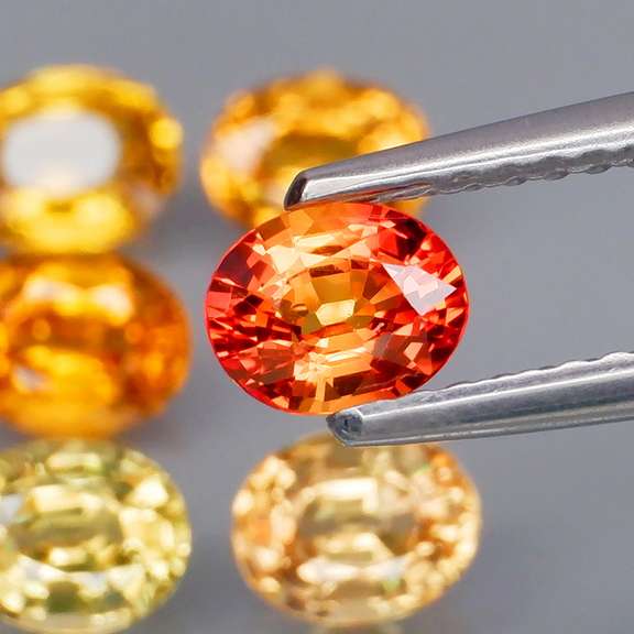 Brilliant 2.75ct fancy orange Songean Sapphire set