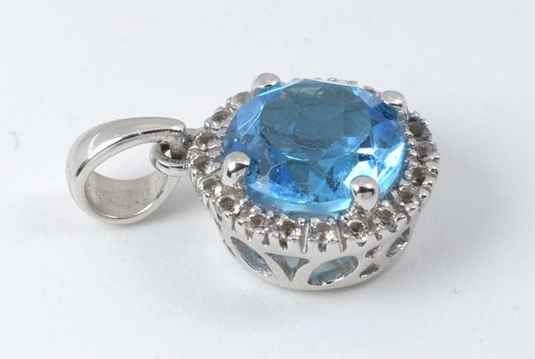 Bright Blue Topaz and Diamond Pendant