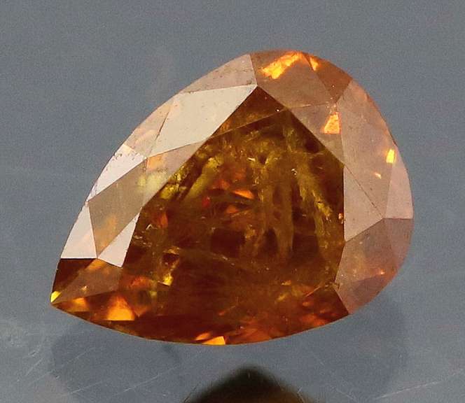 One of a kind! .37ct amber Diamond