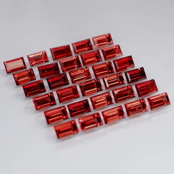 Nice 9.78ct emerald cut cherry red Garnet set