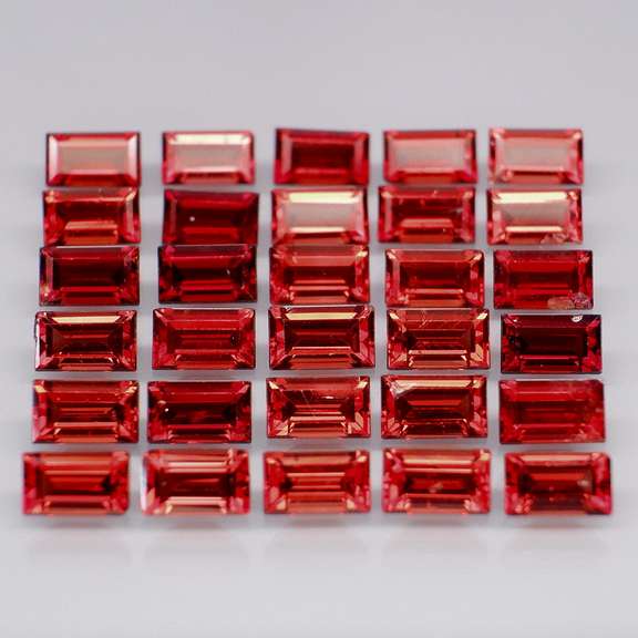 Nice 9.78ct emerald cut cherry red Garnet set