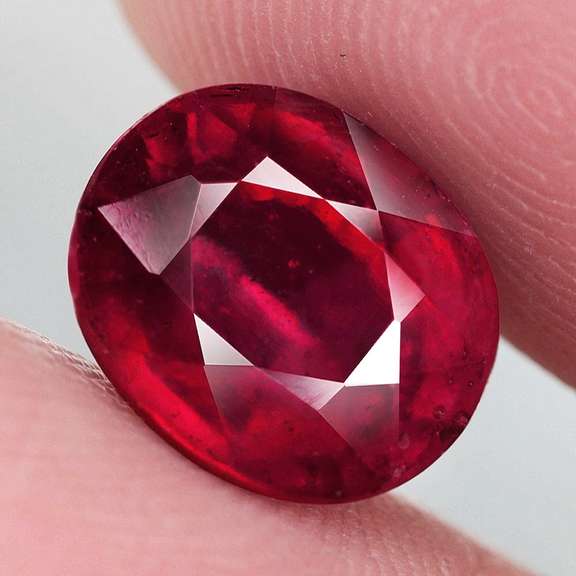 Stunning 7.14ct deep blood red Ruby center stone