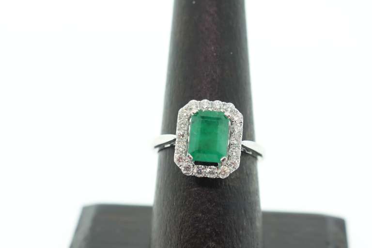 Stunning Emeral Halo Ring with Diamonds and an 18k Stamped White Gold Band