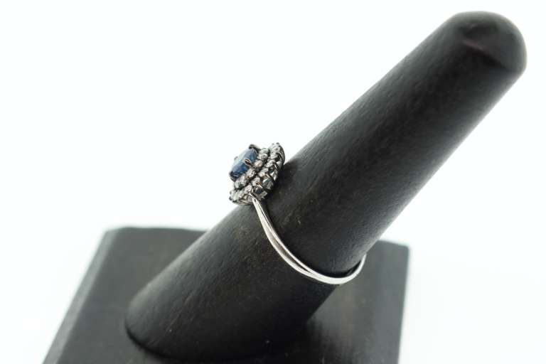 18k White Gold Sapphire Halo Ring surrounded with Diamonds