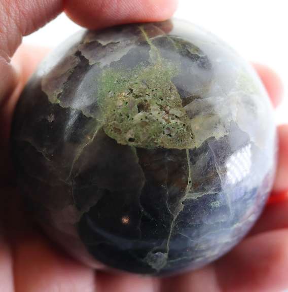 Substantial 1,611ct sphere cut galaxy patterned Iolite