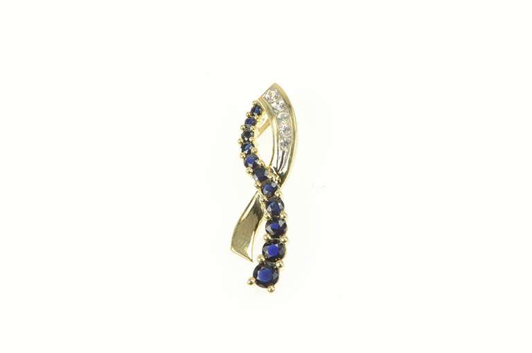10K Yellow Gold Classic Loop Criss Cross Synthetic Sapphire CZ Pendant