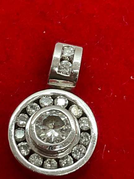 14K WHITE GOLD AND DIAMOND PENDANT.