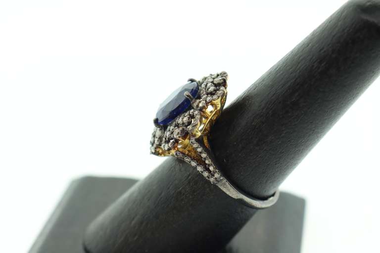 Impeccable Sapphire Ring with Intricate Diamond Studs on top Gold Plated Silver