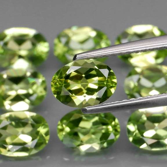 Dazzling 7.40ct untreated apple green Peridot set