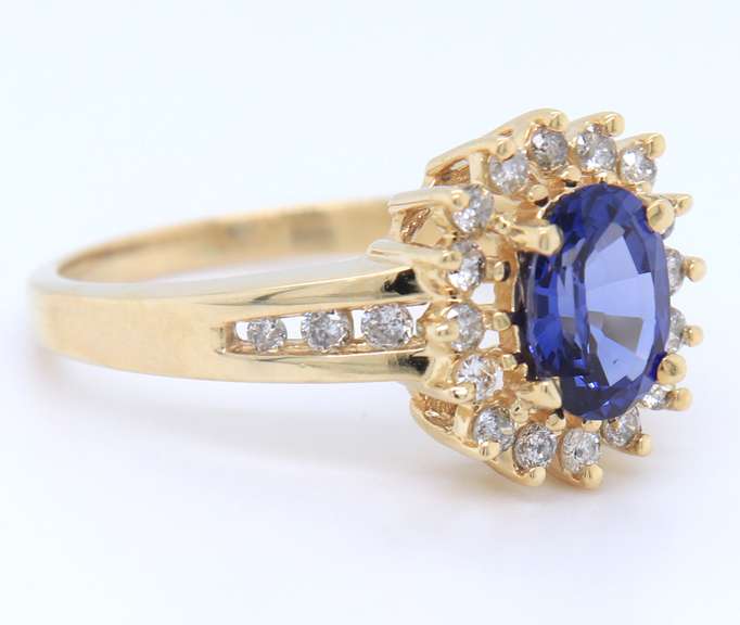 Romantic Yellow Gold oval Shaped Tanzanite and Diamond Ring