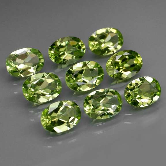 Dazzling 7.40ct untreated apple green Peridot set
