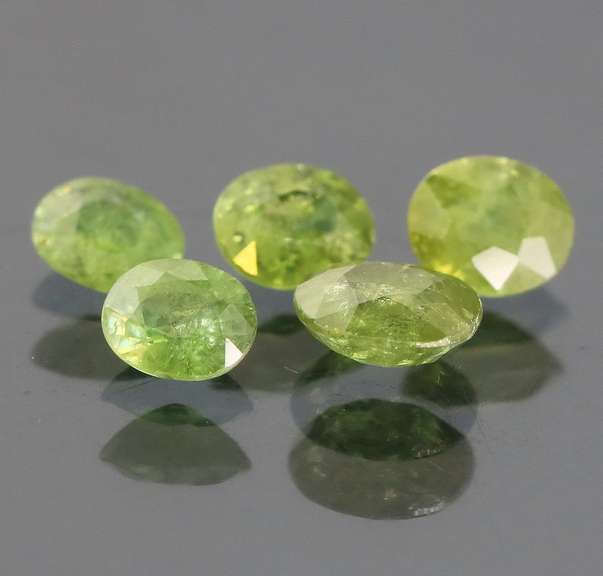 Eye catching 3.70ct untreated Demantoid Garnet set