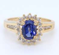 Romantic Yellow Gold oval Shaped Tanzanite and Diamond Ring