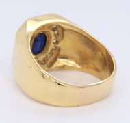 Handsome Yellow Gold oval Sapphire and Diamond Channel Halo Ring