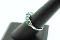 Mesmerizing Four-Stone Emerald 18k White Gold Ring edged with Diamonds