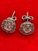 LADIES 14K GOLD AND DIAMOND STUDS.