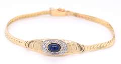 Lovely Yellow Gold Cab Oval Sapphire and Diamond Halo Bracelet