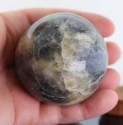 Tremendous 1,378ct sphere cut galaxy patterned Iolite